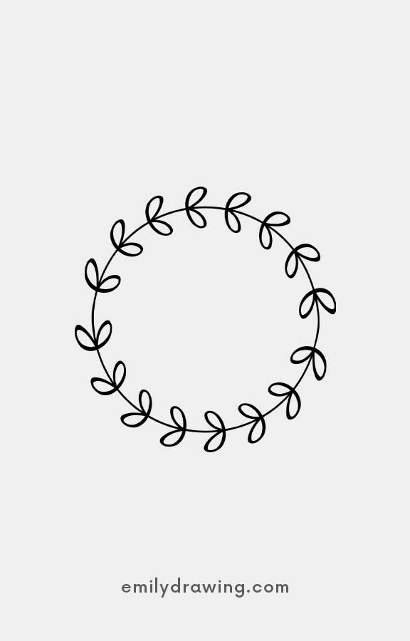 Minimalist circular wreath made of leaves on a white background.